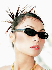 Glamour Thai model Tailynn poses outdoors