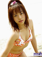 Naughty Hitomi enjoys flashing her hot body while she is wearing her sarong