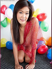 Irene Fah strips in a room full of balloons