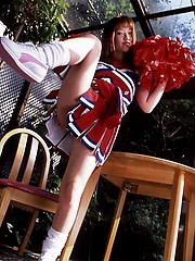 Naughty cheerleader shows her fine assets