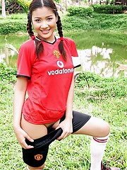 Soccer girl Arisa Sunaree strips out of her uniform on the field